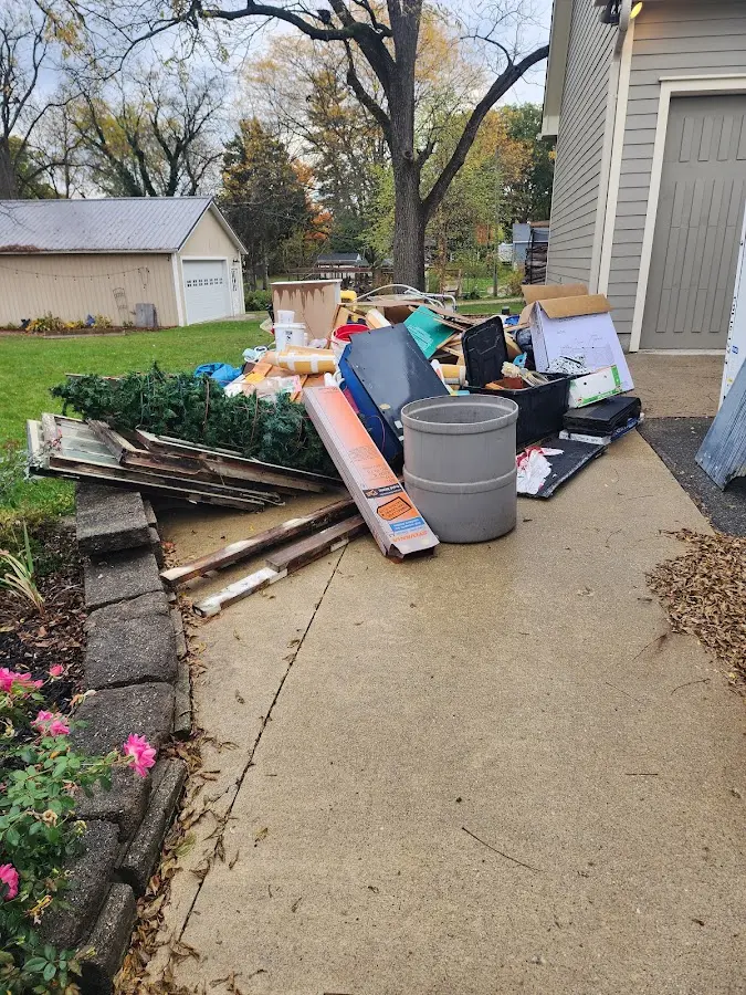 Dumpster being loaded with debris for 3 Yard Dumpster Rental in Long Grove